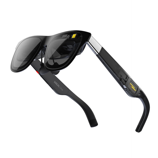 XREAL One AR glasses front view on white background, showing folded temple arms and Bose audio module